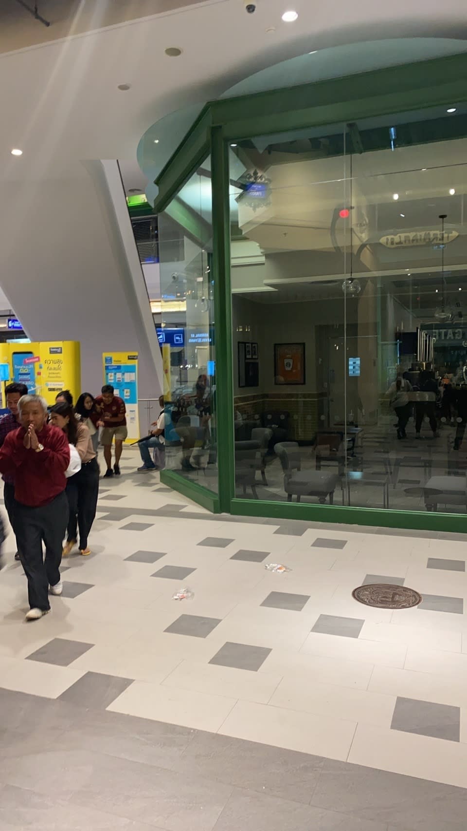 In this photo made availabel by the Crime Suppression Division, people are seen walking inside the Terminal 21 Korat mall in Korat, Thailand on Saturday, Feb. 8, 2020. A soldier shot multiple people in northeastern Thailand on Saturday, killing at least 16, and was holed up in a popular shopping mall, an emergency worker said. (Crime Suppression Division of The Royal Thai Police via AP)