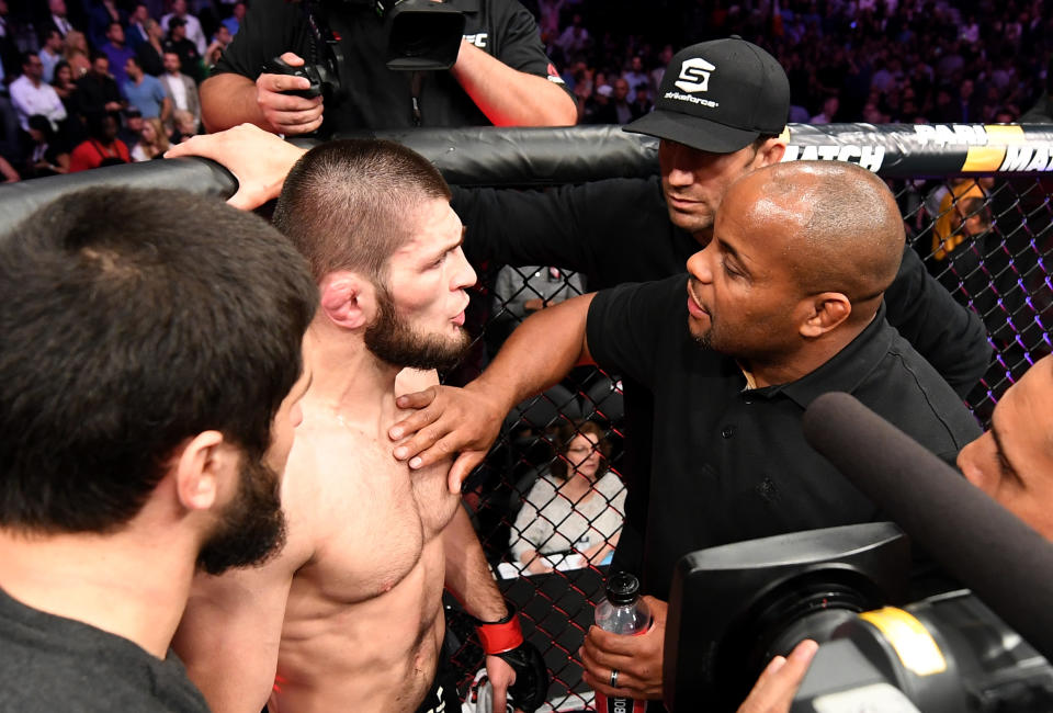 LAS VEGAS, NV - OCTOBER 06:  (R-L) Teammates Daniel Cormier and Luke Rockhold talk to Khabib Nurmagomedov of Russia after a post-fight incident during the UFC 229 event inside T-Mobile Arena on October 6, 2018 in Las Vegas, Nevada. (Photo by Josh Hedges/Zuffa LLC/Zuffa LLC via Getty Images)