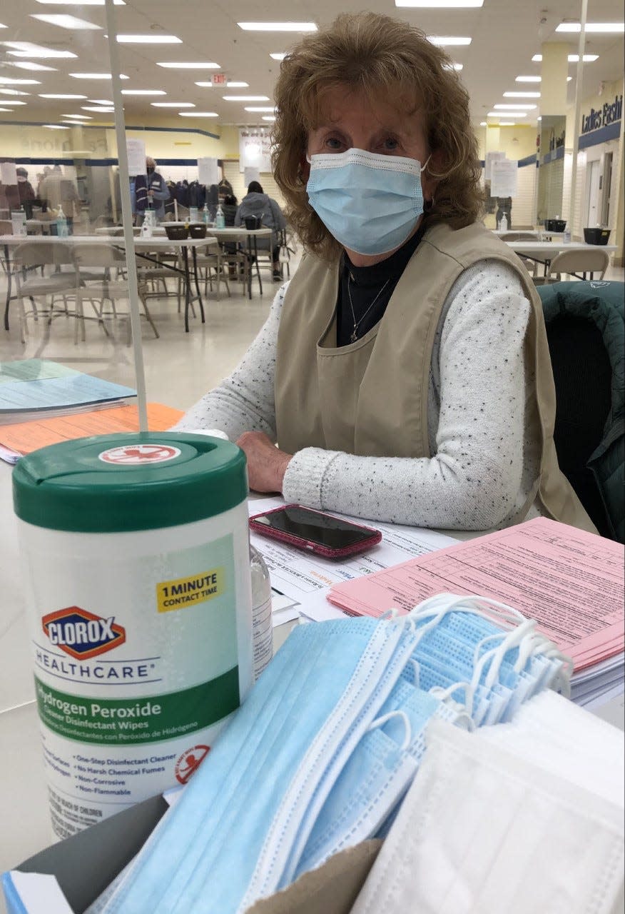 Volunteer Elaine Brady, of the Sanford-Springvale Altrusa Club, is seen here at the vaccine clinic at The Center for Shopping in Sanford on Tuesday, Jan. 18, 2022.