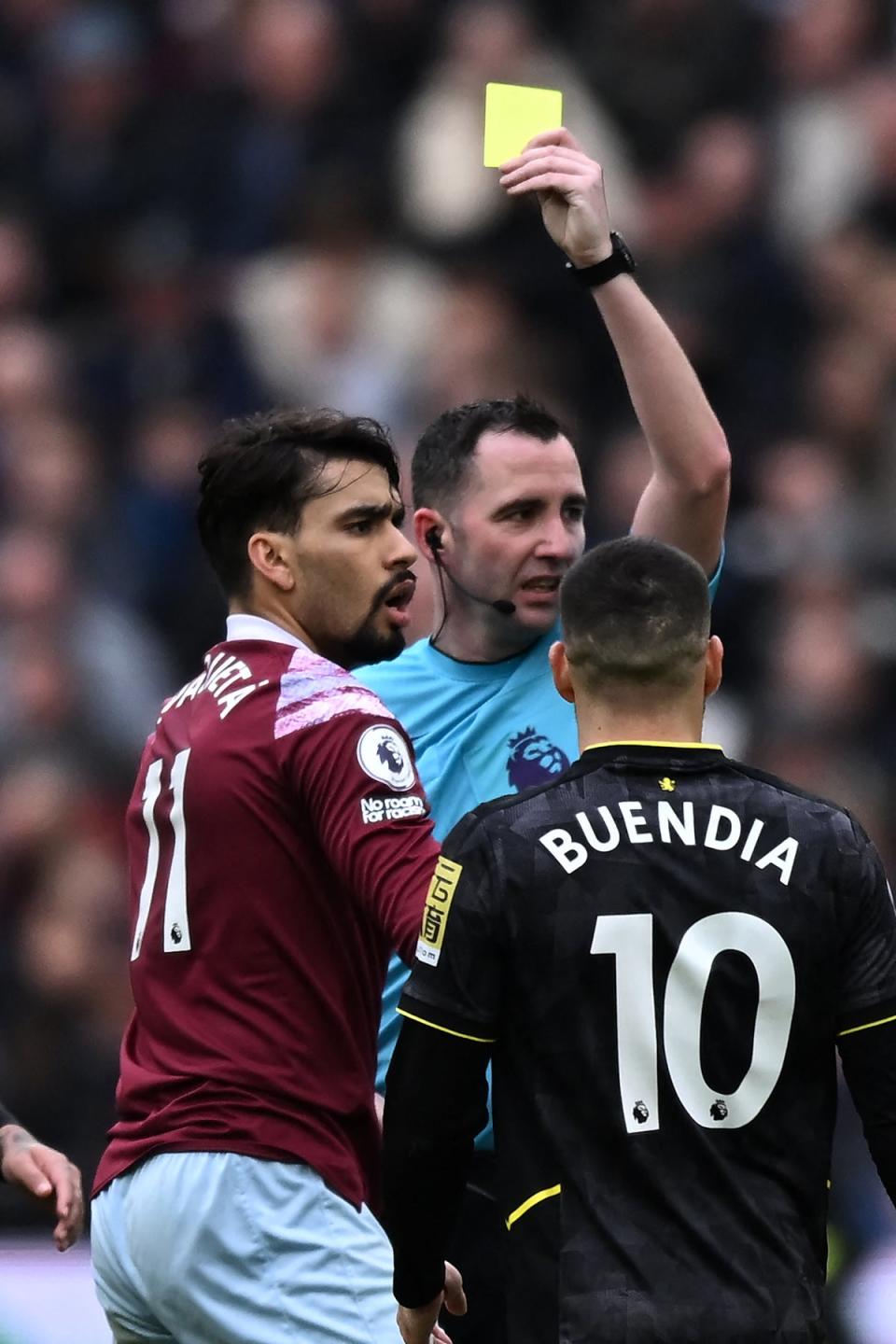 Lucas Paqueta is booked vs Aston Villa (AFP via Getty Images)