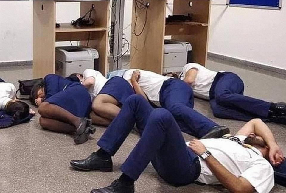 So-called truth behind staged photo of Ryanair airline staff 'sleeping' on the floor.