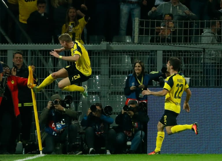 Dortmund's midfielder André Schuerrle kicks the corner flag after scoring against Real Madrid