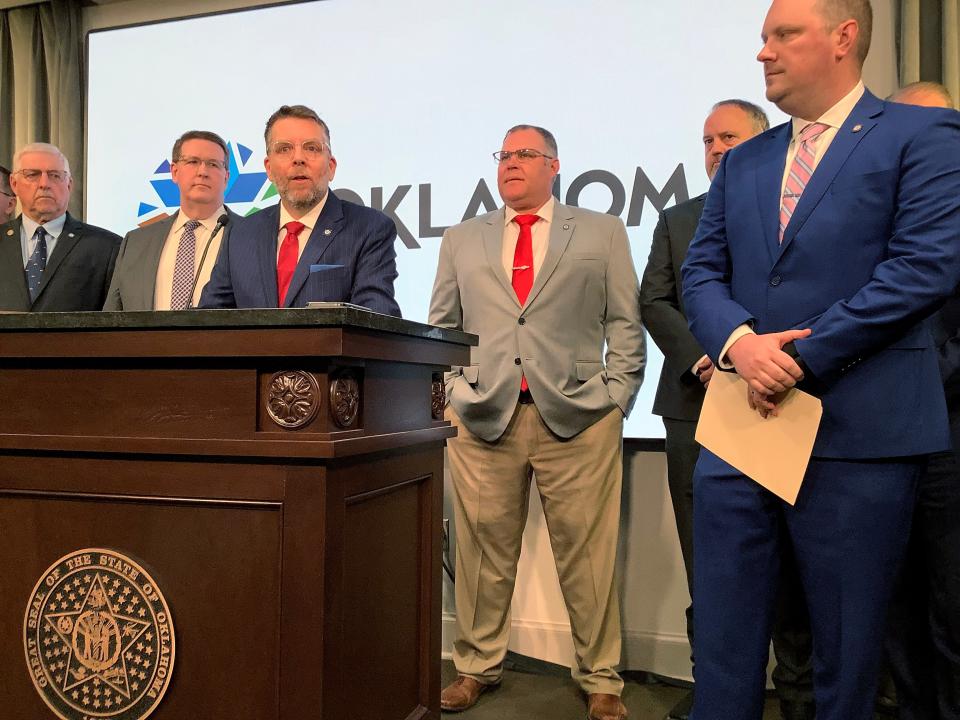 State Rep. Marcus McEntire (center, speaking) and other lawmakers joined Oklahoma Insurance Commissioner Glen Mulready at a news conference Monday to criticize CVS Caremark's communications with Oklahoma customers.