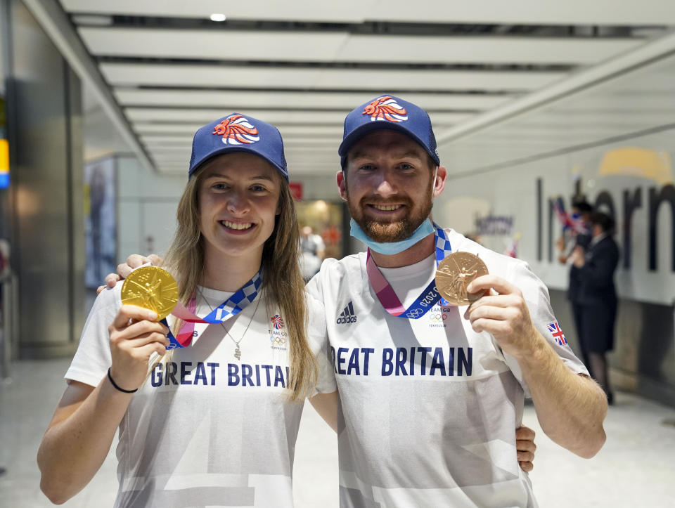 Charlotte Worthington who won gold in the BMX Freestyle and Declan Brooks who won bronze arrive back at London Heathrow Airport from the Tokyo 2020 Olympic Games. Picture date: Tuesday August 3, 2021.