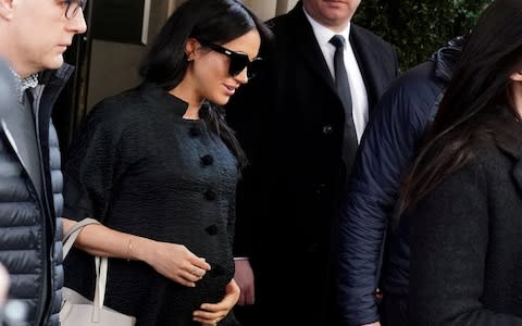 Meghan Markle exits a hotel in Manhattan after flying to New York for her baby shower - Credit: Carlo Allegri/Reuters