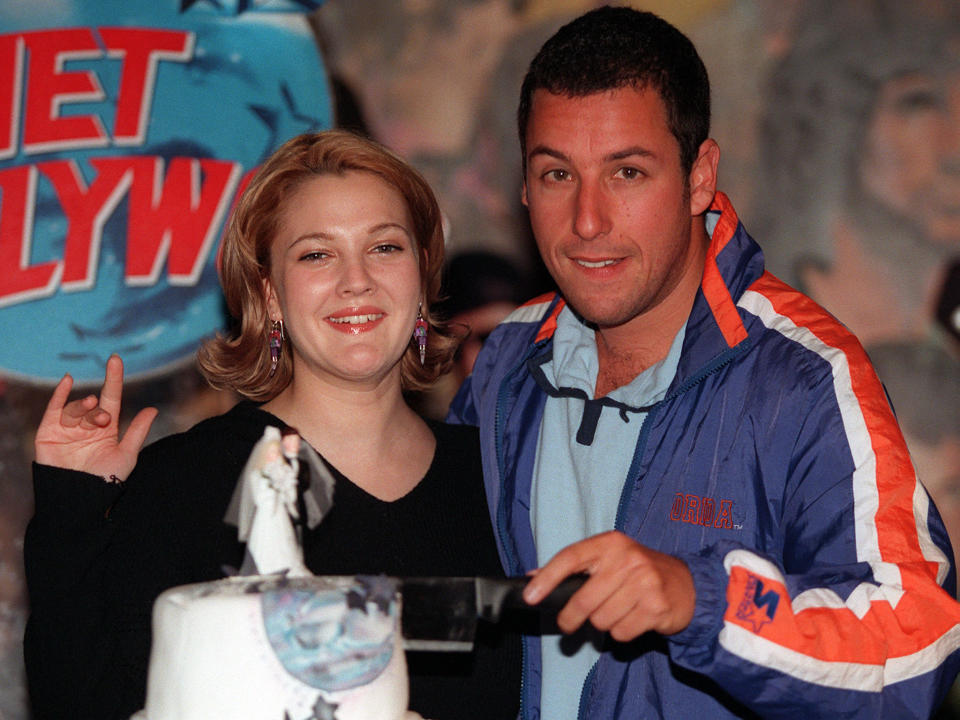 American comedian Adam Sandler cuts a wedding cake with actress Drew Barrymore to launch their new film, May 22. 'The Wedding Singer' is a romantic comedy and will be released on June 5.

MC/CLH/