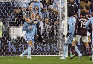 KANSAS CITY, KS - NOVEMBER 02: Aurelien Collin #78 of Sporting Kansas City scores as goalkeeper Matt Pickens #18 of the Colorado Rapids tries to make a save during the MLS playoff game on November 2, 2011 at LiveStrong Sporting Park in Kansas City, Kansas. (Photo by Jamie Squire/Getty Images)