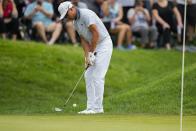 Rickie Fowler chips from the rough on the ninth green during the third round of the Travelers Championship golf tournament at TPC River Highlands, Saturday, June 24, 2023, in Cromwell, Conn. (AP Photo/Frank Franklin II)