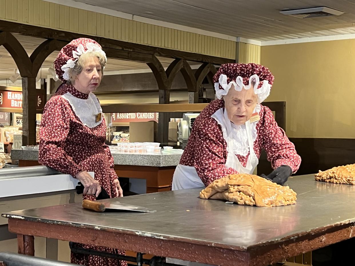 Silver Dollar City guests take home 40,000 pounds of freshly-made peanut brittle each year. And, the women responsible for making the sweet treat provide demonstrations of their craft throughout the day. (Photo: Terri Peters)