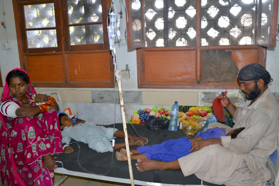 Children, who are suffering from gastroenteritis due to hot weather, receive treatment at a hospital in Hyderabad, Pakistan, Thursday, May 23, 2024. Doctors were treating hundreds of victims of heatstroke at various hospitals across Pakistan on Thursday after an intense spell of the heatwave began in the country, and the mercury rose to above normal due to climate change, officials said. (AP Photo/Pervez Masih)