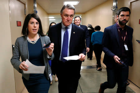 FILE PHOTO: U.S. Senator David Perdue (R-GA) arrives for the weekly Republican party caucus luncheon at the U.S. Capitol in Washington, U.S., January 17, 2018. REUTERS/Jonathan Ernst