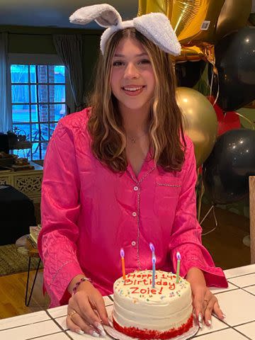 Jodie Sweetin Instagram Jodie Sweetin's daughter Zoie smiles next to a birthday cake