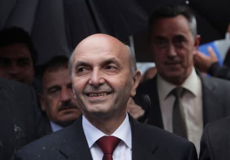 Leader of the biggest opposition party Democratic League of Kosovo (LDK) Isa Mustafa attends an election rally in the western Kosovo town of Peja June 1, 2014. REUTERS/Hazir Reka/Files