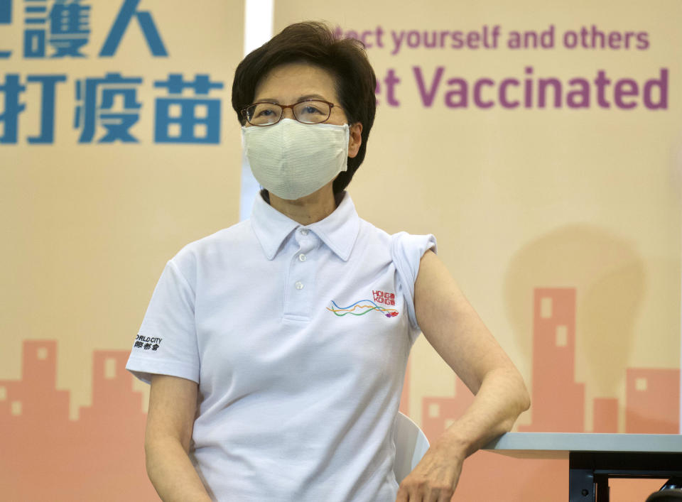 Hong Kong Chief Executive Carrie Lam waits to receive COVID-19 vaccinations at a Community Vaccination Centre in Hong Kong Monday, Feb. 22, 2021. Hong Kong leader Carrie Lam and a host of other government officials on Monday received the COVID-19 vaccine developed by Chinese biopharmaceutical company Sinovac, as the city prepares to roll out its vaccination program. (AP Photo/Vincent Yu)