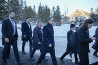 U.S. Secretary of State Antony Blinken, centre, with his entourage, walks from panel to panel at the Annual Meeting of World Economic Forum in Davos, Switzerland, Tuesday, Jan. 16, 2024. The annual meeting of the World Economic Forum is taking place in Davos from Jan. 15 until Jan. 19, 2024.(AP Photo/Markus Schreiber)