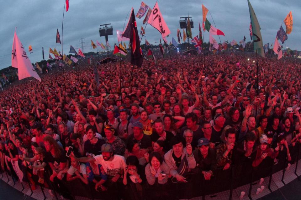 Fans watch Radiohead perform their headline set (Rex Features)