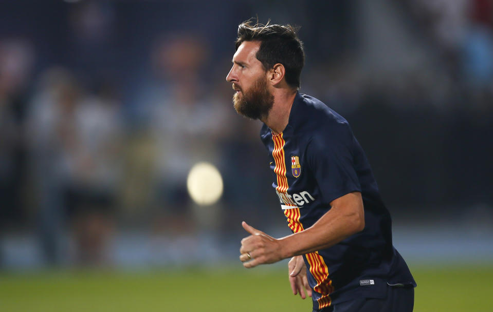 Barcelona's Lionel Messi exercises during warmup before the Spanish Super Cup soccer match between Sevilla and Barcelona in Tangier, Morocco, Sunday, Aug. 12, 2018. (AP Photo/Mosa'ab Elshamy)