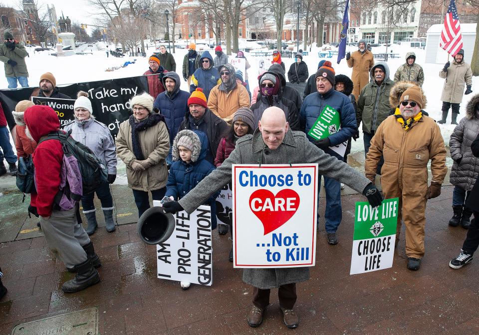 John Kleiner, center, an anti-abortion supporter, is shown with about 200 others at the March for Life rally, Jan. 29, 2022, at Perry Square in Erie.