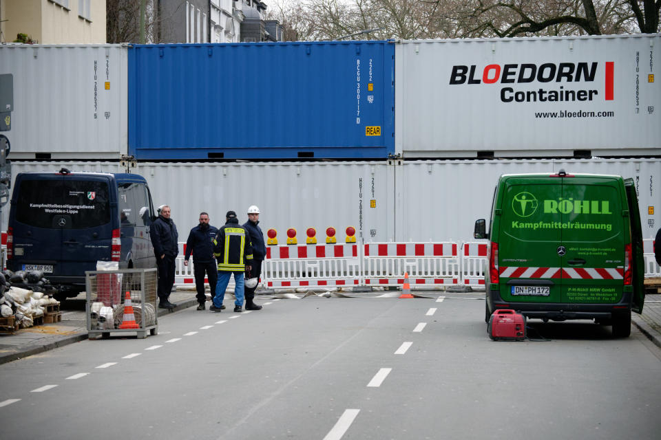 A road is blocked with containers in Dortmund, Germany, Sunday, Jan. 12, 2020. Thousands of people are evacuating in the western Germany city of Dortmund as experts are getting ready to defuse up to four bombs from World War II. (Henning Kaiser/dpa via AP)