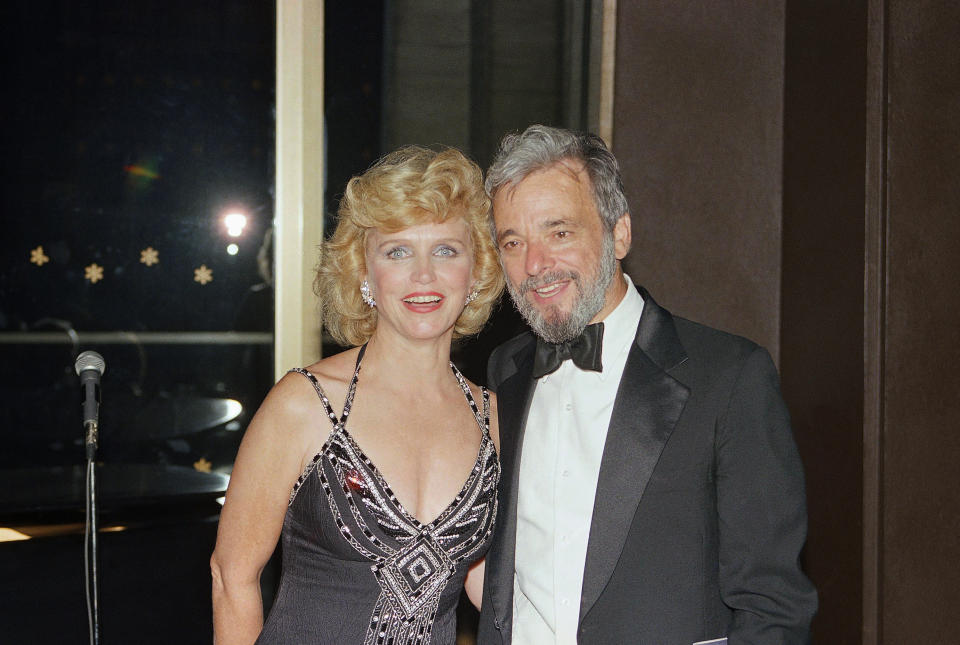 FILE - In this Sept. 7, 1985 file photo, Lee Remick, left, poses for a photo with Stephen Sondheim, right, during the finale and curtain call at Follies, party at Avery Fischer Hall in Lincoln Center, in New York. Sondheim, the songwriter who reshaped the American musical theater in the second half of the 20th century, has died at age 91. Sondheim's death was announced by his Texas-based attorney, Rick Pappas, who told The New York Times the composer died Friday, Nov. 26, 2021, at his home in Roxbury, Conn. (AP Photo/Mario Suriani, File)