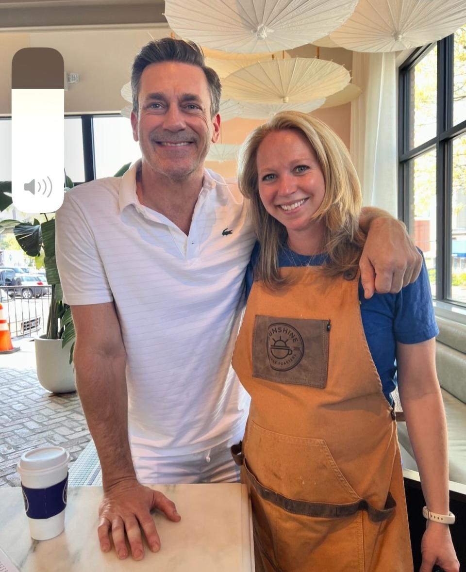 Actor Jon Hamm, left, with Mariela Iacono, co-owner of Sunshine Coffee Roasters in Rye. Hamm was in Westchester filming the new Apple TV drama series "Your Friends and Neighbors,” based on an original idea by screenwriter, producer and novelist Jonathan Tropper.