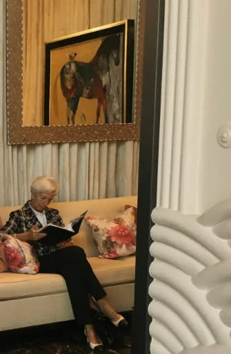 International Monetary Fund chief Christine Lagarde consults a document after arriving for the Peace to Prosperity workshop in Manama, Bahrain