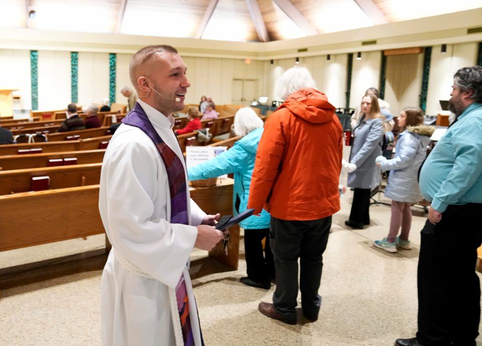 The Rev. TJ Lynch greets members of his church before the start of services at Gethsemane Lutheran Church. The young pastor believes that his experience overcoming an inoperable brain tumor allows him to better relate to congregants.