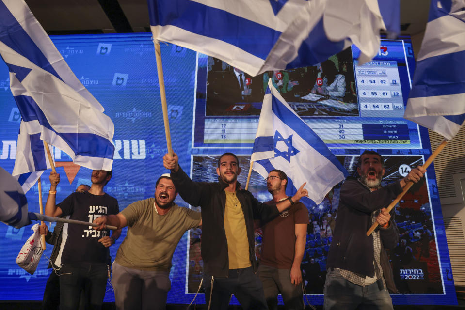 Supporters of Israeli far-right lawmaker and the head of "Jewish Power" party, Itamar Ben-Gvir, celebrates after first exit poll results for the Israeli Parliamentary election at the party's headquarters in Jerusalem, Tuesday, Nov. 1, 2022. (AP Photo/Oren Ziv)