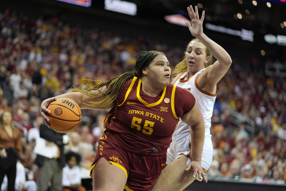 Iowa State center Audi Crooks (55) drives past Texas forward Taylor Jones (44) during the first half of an NCAA college basketball game for the Big 12 tournament championship Tuesday, March 12, 2024, in Kansas City, Mo. (AP Photo/Charlie Riedel)