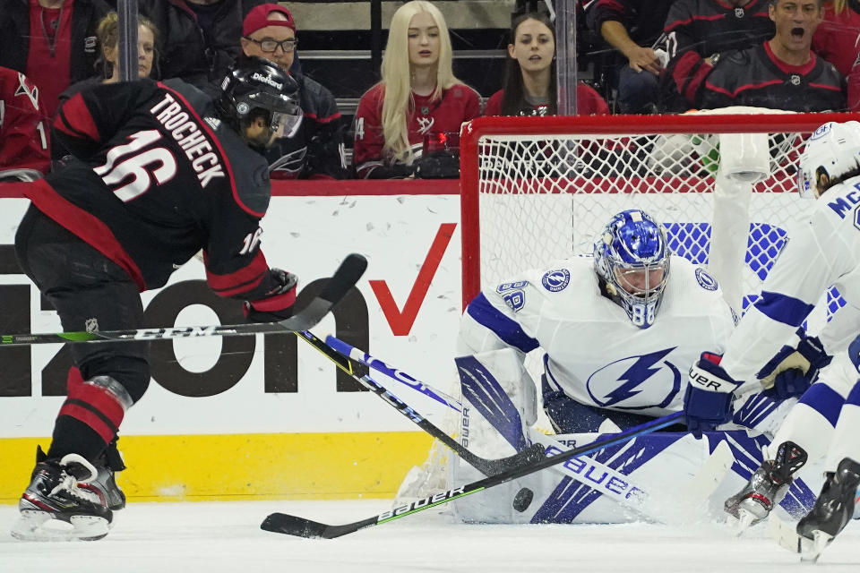 Tampa Bay Lightning goaltender Andrei Vasilevskiy (88) blocks against Carolina Hurricanes center Vincent Trocheck (16) during the first period in Game 1 of an NHL hockey Stanley Cup second-round playoff series in Raleigh, N.C., Sunday, May 30, 2021. (AP Photo/Gerry Broome)