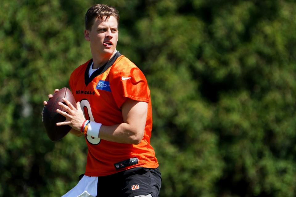 Cincinnati Bengals quarterback Joe Burrow (9) throws during practice, Tuesday, May 17, 2022, at the Paul Brown Stadium practice fields in Cincinnati. 