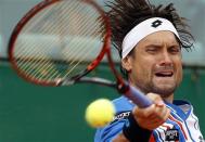 David Ferrer of Spain returns the ball to his compatriot Rafael Nadal during their quarter-final match at the Monte Carlo Masters in Monaco April 18, 2014. REUTERS/Eric Gaillard