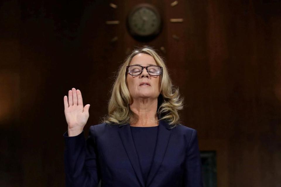Christine Blasey Ford is sworn in before her testimony at the Senate judiciary committee in Washington DC on 27 September 2018.