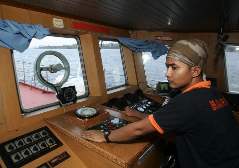 A member of a rescue team during the search and rescue operation to find the missing Malaysia Airlines flight MH370, in the Strait of Malacca, yesterday. – Reuters pic, March 15, 2014.