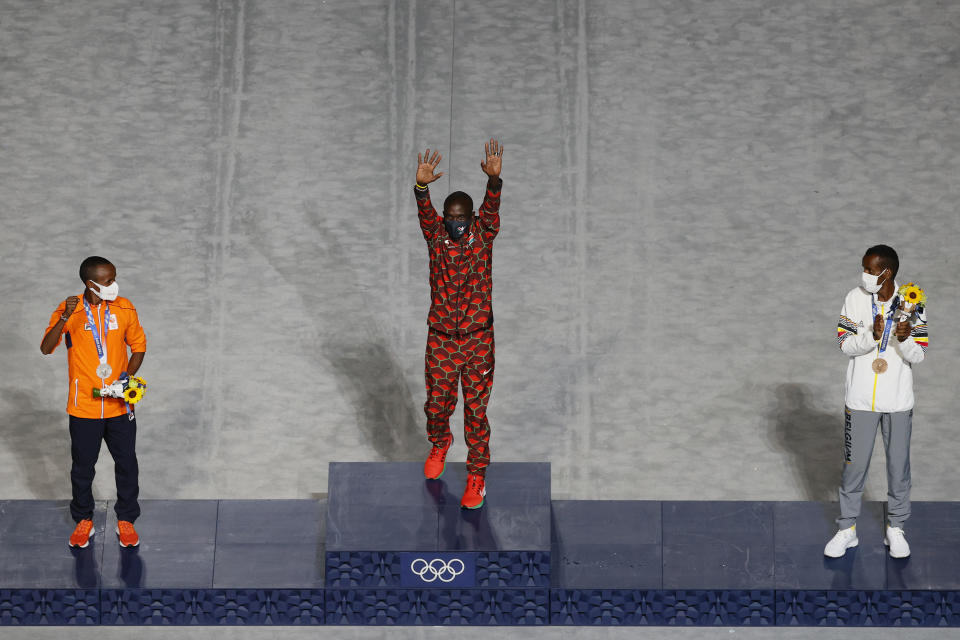 <p>Gold medalist Eliud Kipchoge of Team Kenya poses during the medal ceremony for the Men's Marathon Final during the Closing Ceremony of the Tokyo 2020 Olympic Games at Olympic Stadium on August 08, 2021 in Tokyo, Japan. (Photo by Steph Chambers/Getty Images)</p> 