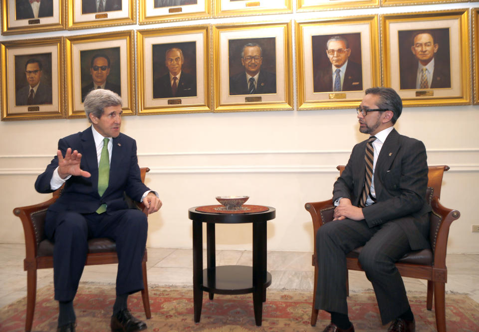 U.S. Secretary of State John Kerry, left, gestures during a meeting with Indonesian Foreign Minister Marty Natalegawaat the Foreign Ministry office in Jakarta, Indonesia Monday, Feb. 17, 2014. (AP Photo/Adi Weda, Pool)