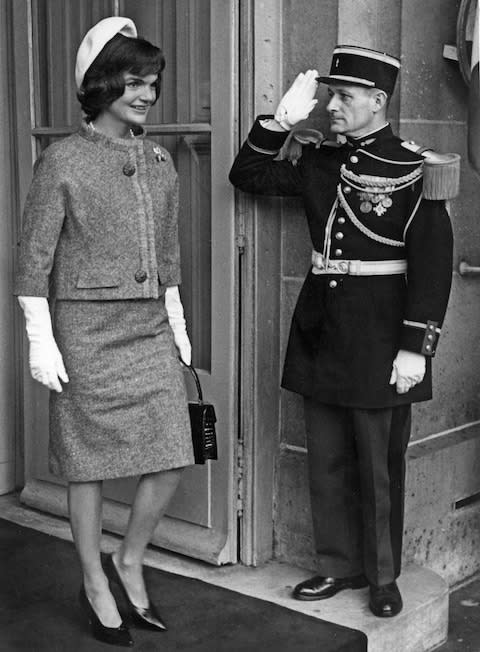 Jackie Kennedy wearing a suit by Hubert de Givenchy for Ninon on a visit to Paris in 1961 - Credit: Getty