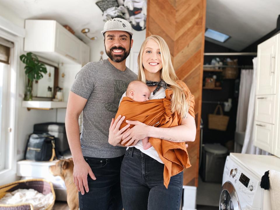 The Soine family standing inside their tiny house