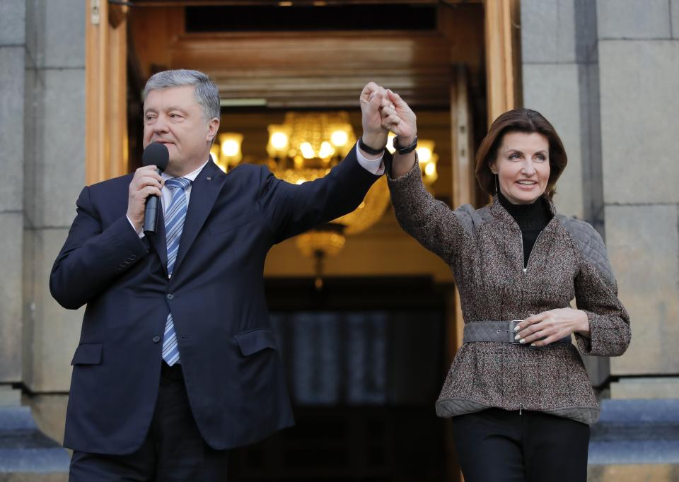 Ukrainian President Petro Poroshenko and his wife Maryna greet their supporters who have come to thank him for what he did as a president, in Kiev, Ukraine, Monday, April 22, 2019. Political mandates don't get much more powerful than the one Ukrainian voters gave comedian Volodymyr Zelenskiy, who as president-elect faces daunting challenges along with an overwhelming directive to produce change. (AP Photo/Vadim Ghirda)