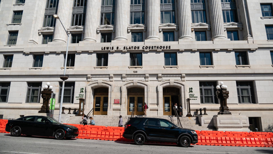 Security barriers line the sidewalk in front of the Lewis R. Slaton Courthouse in Atlanta, Georgia, on July 31, 2023. / Credit: ELIJAH NOUVELAGE/AFP via Getty Images