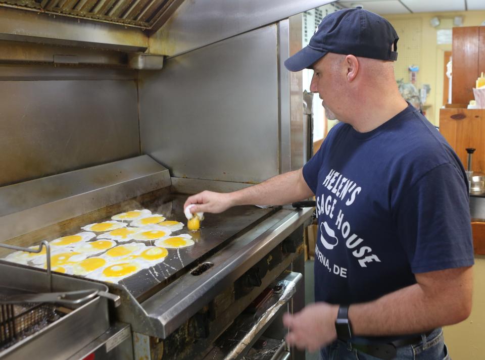 Cliff Murphy, owner of Helen's Sausage House, cooking eggs on a weekday morning.  The famous Delaware eatery will serve over 300 eggs on a normal weekday.