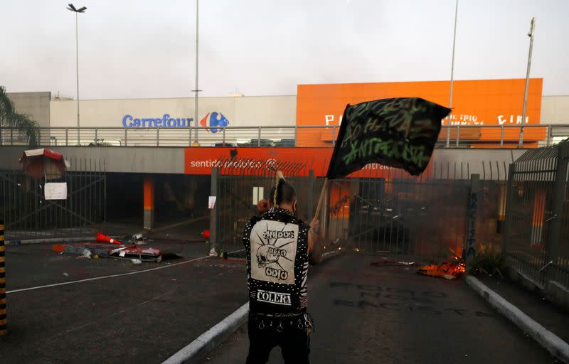 Demonstrators vandalize a Carrefour store during a protest against racism, after Joao Alberto Silveira Freitas was beaten to death by security guards at a Carrefour supermarket in Porto Alegre