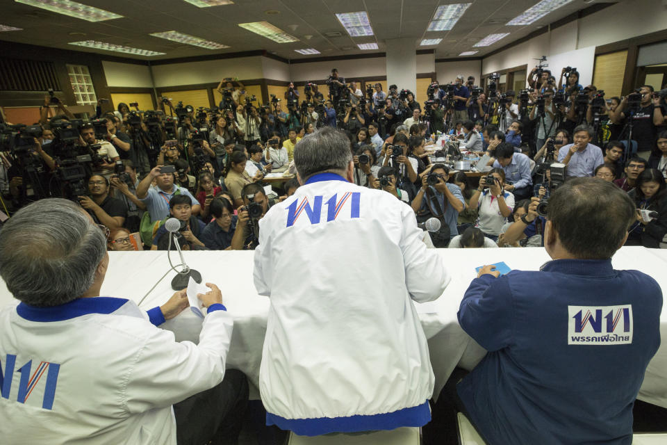 Senior leaders of Pheu Thai party, from right, party leader Virot Pao-In, Secretary General Phumtam Wechayachai, and Chusak Sirinil hold a press conference at party head quarters in Bangkok, Thailand, Sunday, March 24, 2019. Figures from Thailand's Election Commission show a military-backed party has taken the lead in the country's first election since a 2014 coup. (AP Photo/Wason Wanichakorn)