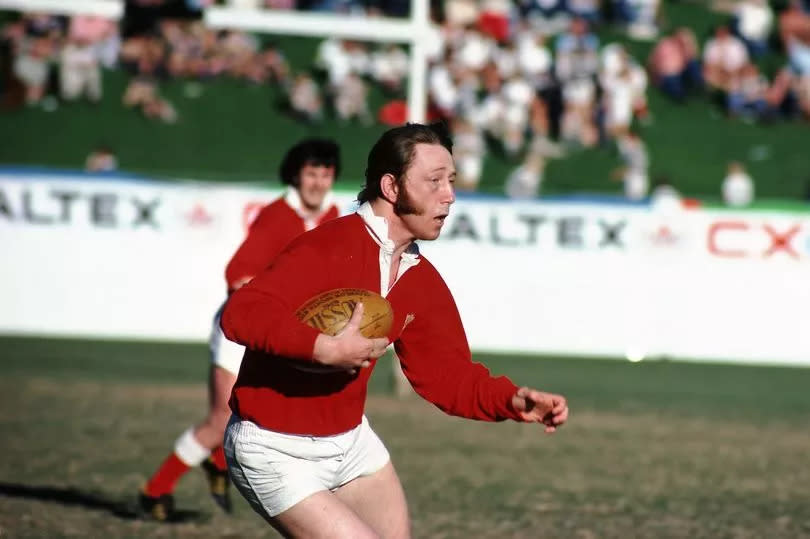 JPR Williams in red Wales kit with ball in hand