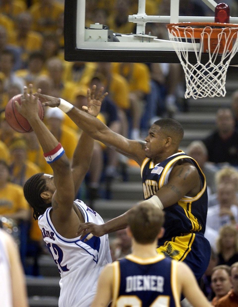 Marquette's Robert Jackson blocks a shot by Kansas' Jeff Graves during their NCAA tournament semifinal at the Superdome in New Orleans.