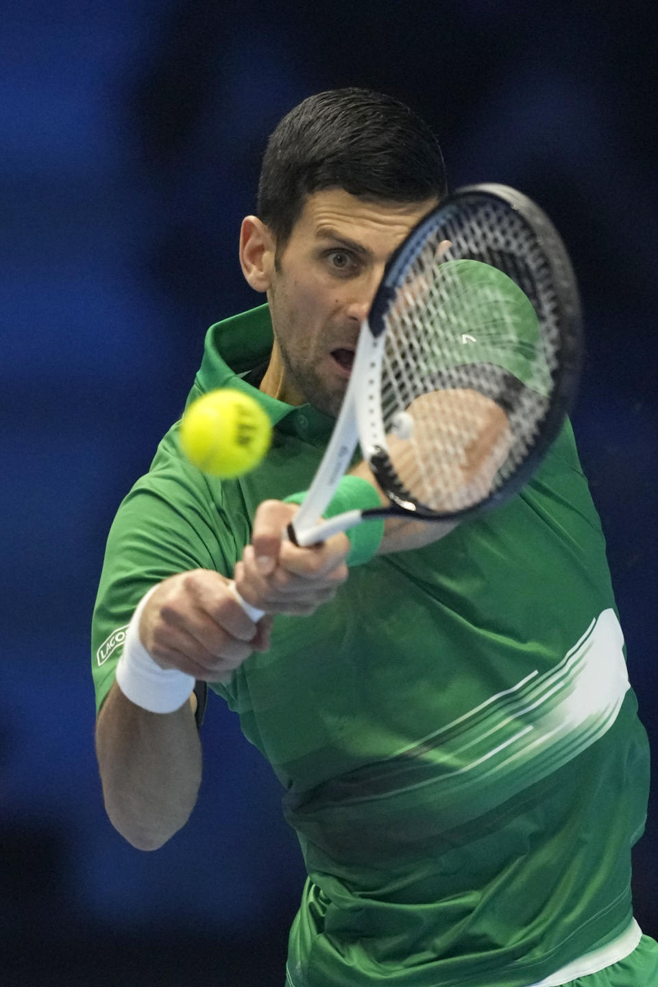 Serbia's Novak Djokovic returns with a backhand to Norway's Casper Ruud during their singles final tennis match of the ATP World Tour Finals at the Pala Alpitour, in Turin, Italy, Sunday, Nov. 20, 2022. (AP Photo/Antonio Calanni)