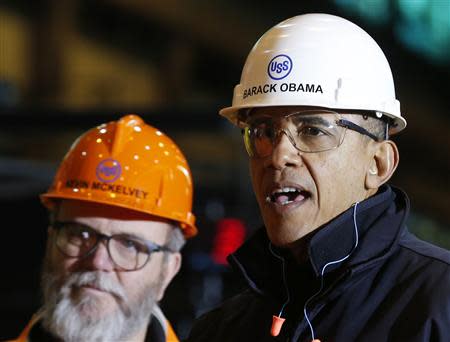 U.S. President Barack Obama wears a helmet as he tours the U.S. Steel Irvin Plant in West Mifflin, Pennsylvania, January 29, 2014. REUTERS/Larry Downing