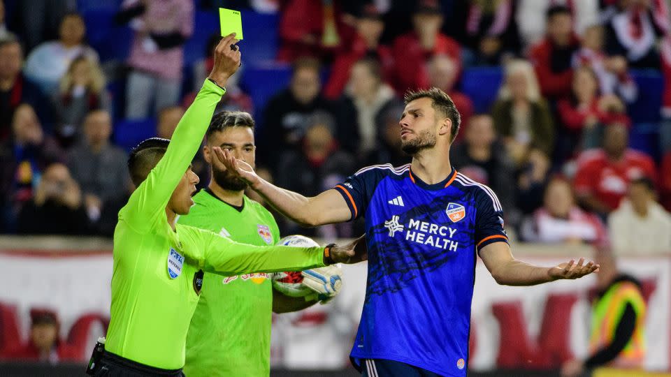 Miazga is booked by Rivas during the shootout. - Howard Smith/ISI Photos/Getty Images