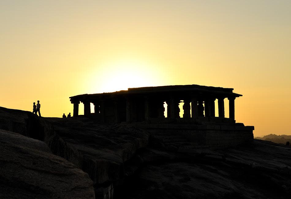 On an evening at Hampi, turn left into the narrow lane at the entrance of the Virupaksha temple. A short walk up Hemakuta hill sets you up to witness a memorable sunset.