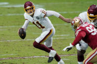 Washington Football Team quarterback Alex Smith (11) scrambles against the San Francisco 49ers during the first half of an NFL football game, Sunday, Dec. 13, 2020, in Glendale, Ariz. (AP Photo/Ross D. Franklin)